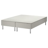 A white SNARUM bed base with a sprung mattress and metal legs. Its rectangular and designed for comfort.