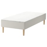 White SNARUM bed base with sprung mattress, wooden legs.