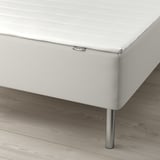 A modern bed with ikea label, featuring supportive bonnell springs and simple design.
