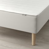 IKEA bed with bonnell spring support; includes wooden legs and mattress topper.