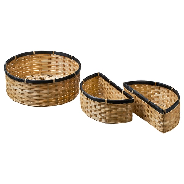 Three interlaced bamboo baskets: one large round, two crescent-shaped, black trimmed, natural finish, rustic design.