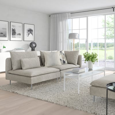 Modern living room with light gray SÖDERHAMN sectional sofa, white coffee table, and large windows.