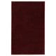 A red rectangular SÖDERSJÖN bath mat. It is made from soft cotton with latex backing.
