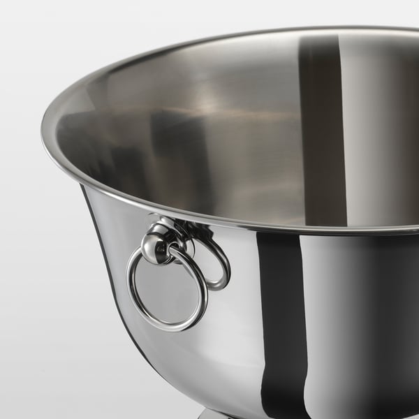 Shiny metallic champagne bowl, polished stainless steel, reflective interior, sturdy handles.