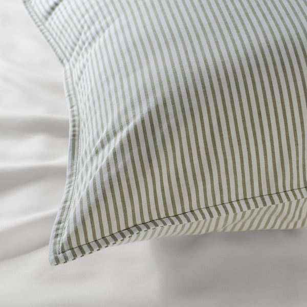 Striped cotton pillow with precise stitching, showcasing quality craftsmanship and natural texture.