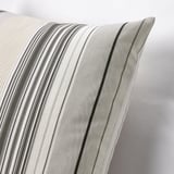 Stylish cushion with grey and beige stripes. Soft, high-quality cotton feel. Hidden zipper for easy cover removal.