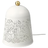 A white SOLSKUR table lamp with a nature-inspired design, a round brass top, and a power cord.