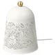A white SOLSKUR table lamp with a nature-inspired design, a round brass top, and a power cord.