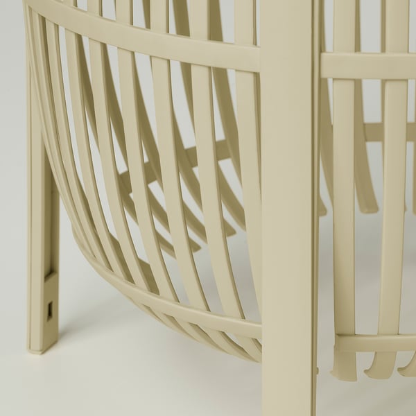 Modern lamp with intricate, curved slats. Light-colored, stylish design.