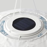 Solar-powered circular lamp with white frame, dark solar panel.