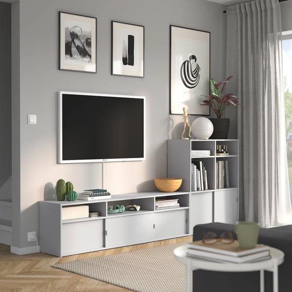 Modern living room with SPIKSMED tv bench, plants, and decor.