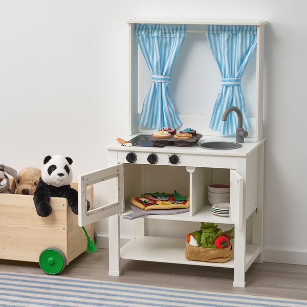 Play kitchen with sink, stove, and pretend food. Curtains can close for role-playing.