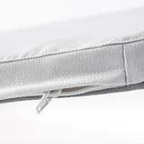 Close-up of a white chair pads zipper detail, showcasing quality stitching and materials.