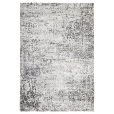 Grey rectangular rug, low-pile, mottled design, durable & soft.