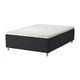 Black and white square-patterned bed with wooden legs.