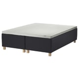 This image shows the STAVANGER black 2-part mattress base with light grey mattress, featuring wooden legs, on a white background.