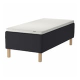 STAVANGER bed: black with white mattress, wooden legs; modern, minimalist design.