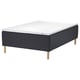 The STAVANGER mattress set in dark grey with wooden legs. It combines supportive springs and a cooling memory foam top for comfort.