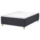 An IKEA STAVANGER bed in black with a white mattress on wooden legs.