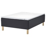 A STAVANGER bed with a dark grey quilted base and light grey mattress on wooden legs.
