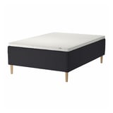 A black and white STAVANGER mattress set with wooden legs. It a quilted top and a sprung base for comfort and air flow.