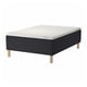 Black & white STAVANGER bed with wooden legs, quilted pattern, white background.