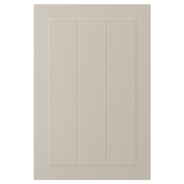 A beige STENSUND cabinet door with a smooth, framed design. Made of fibreboard, it has a lacquered finish that resists moisture and stains.