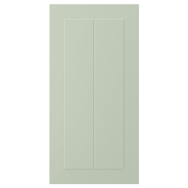 A STENSUND green cabinet door with grooved panels, made of fibreboard and polyurethane paint, rectangular in shape with a sleek design.