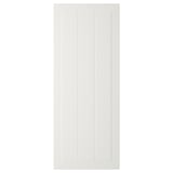 A white, rectangular STENSUND door with vertical grooves, made of fiberboard, lacquered for easy cleaning.