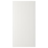 A white STENSUND cabinet door with grooved panels.