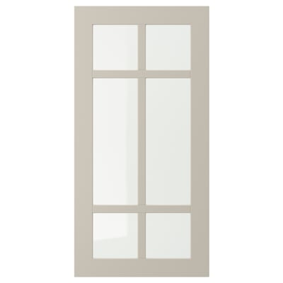STENSUND beige cabinet door with glass panels.