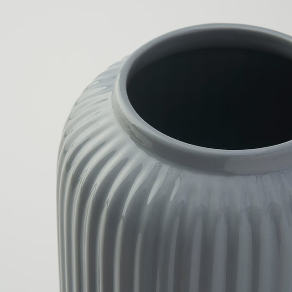 Gray vase with vertical grooves.
