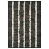 A rectangular gray wool rug with a birch tree pattern, reversible, from the stockholm collection.
