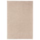 A beige ikea STOENSE area rug with a soft, thick pile, providing comfort and warmth. It has a light sheen, rectangular shape, and a smooth edge.