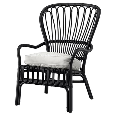 Black rattan chair with white cushion, curved back, armrests. Modern & comfortable.