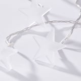 Image shows high-quality white star-shaped lights, likely part of festive outdoor led decor series, arranged neatly.