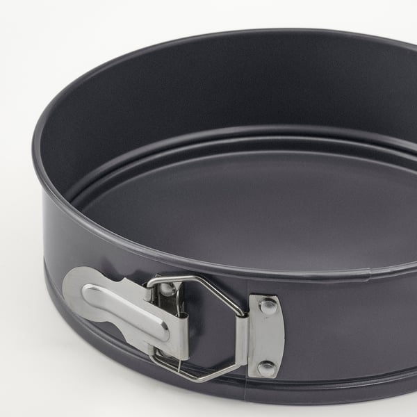 Springform pan with sturdy, non-stick coating, even heat distribution, secure clasp, easy release.
