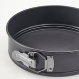 Springform pan with sturdy, non-stick coating, even heat distribution, secure clasp, easy release.