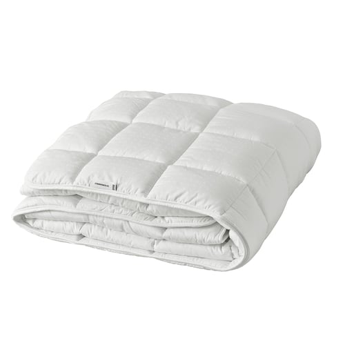 White STRANDMOLKE duvet with textured dobby weave, folded and plush.