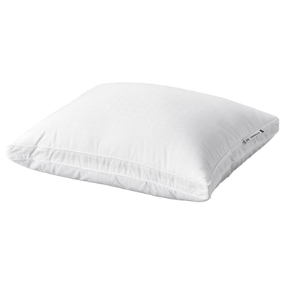 A white STRANDMOLKE pillow with a supportive core and soft outer filling, featuring double piping and a dobby-weave cotton cover.