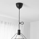 Ceiling light with adjustable cord, hanging bulb shade, modern look, white curtain background.