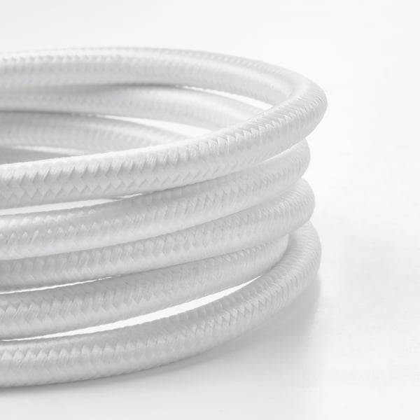 Black & white close-up of textured lamp cord.