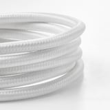 Black & white close-up of textured lamp cord.