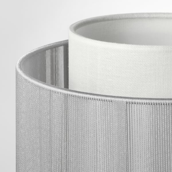 Close-up of modern white lamp shade, showcasing textured design and quality craftsmanship.
