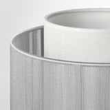 Close-up of modern white lamp shade, showcasing textured design and quality craftsmanship.