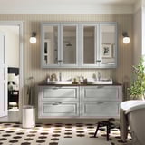 Gray TÄNNFORSEN bathroom vanity with double sink, ample storage, wall mirrors, and spherical lights. Hexagon floor, modern elegance.