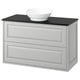 Modern white bathroom vanity with grey countertop, vessel sink, and two drawers. Minimalist design with bevelled drawer fronts.