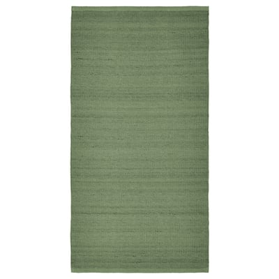Green rectangular wool rug with melange pattern.