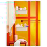 Bright yellow and red bathroom wall unit with white bins holding toiletries. No visible drilling, suction-mounted.