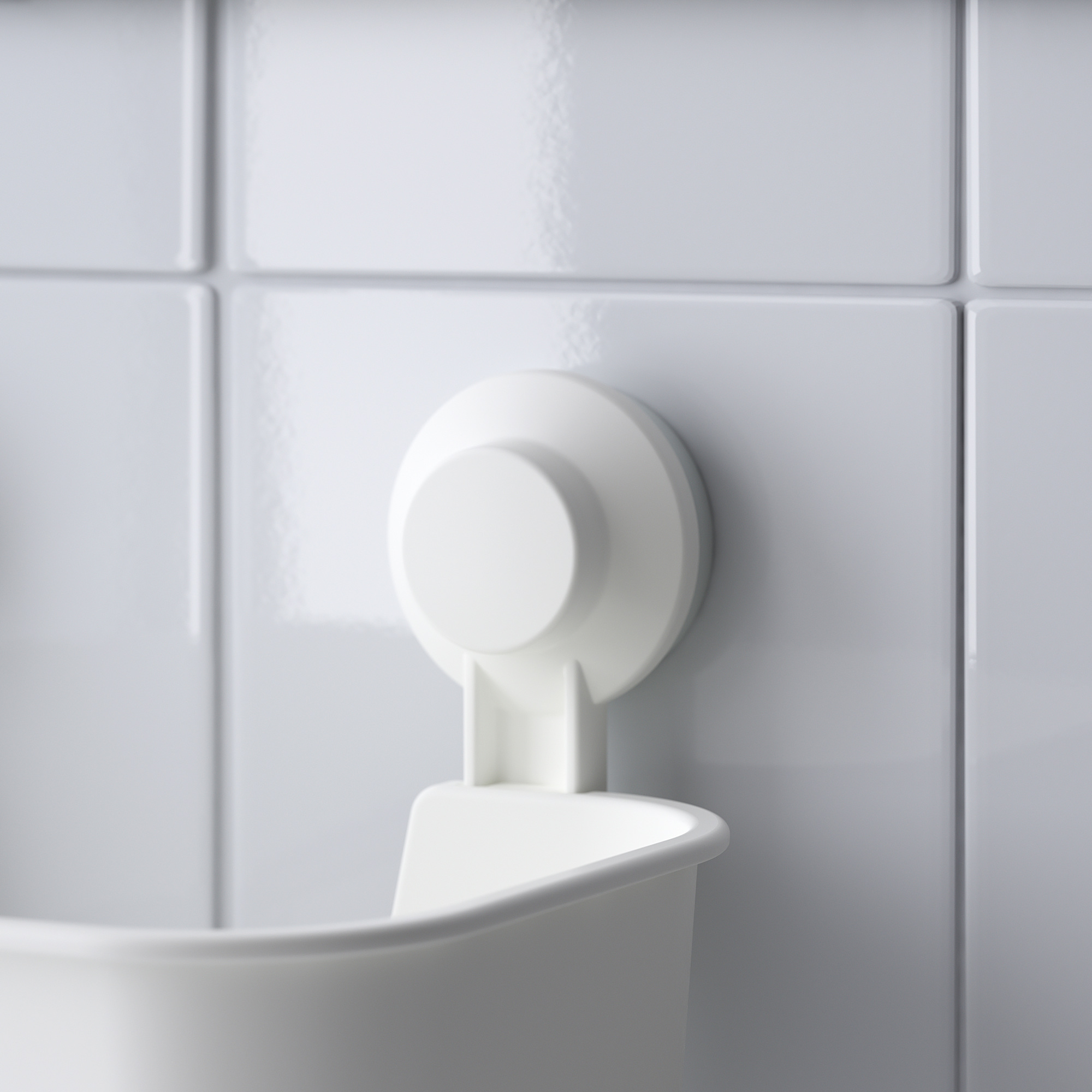 Wall-mounted plastic bowl with suction cup for secure hold on smooth tiles.